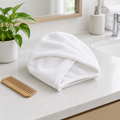 Folded hair towel on a bathroom counter